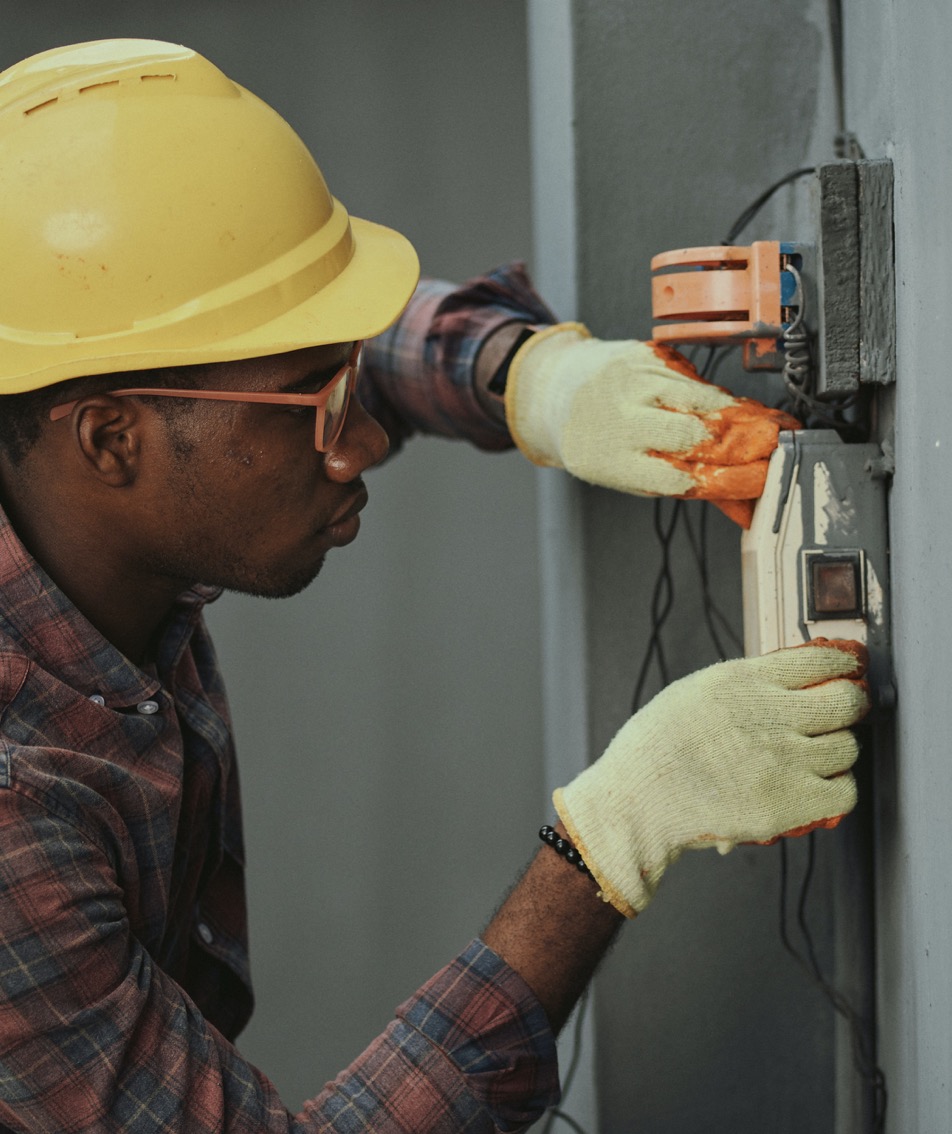 Electrician working on electrical panel